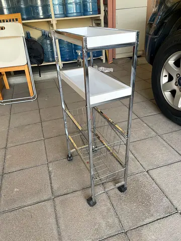Narrow shelf in metal and plastic