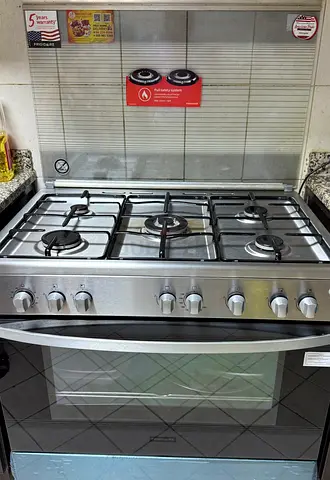 6-Burner Stainless Steel Gas Range with Oven - Good Working Condition