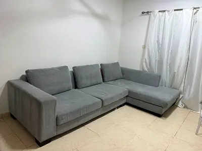 Light grey L-shaped 3-seater corner sofa with chaise
