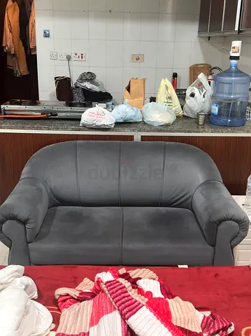 Move out! Sale.. Two-seater grey upholstered sofa in good used condition