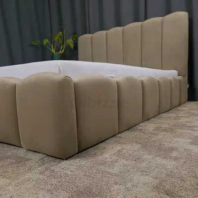 Low-profile upholstered king bed frame with padded headboard (beige)