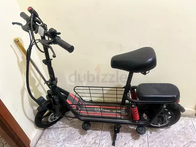 Used electric scooter/moped with dual seats and rear basket - good condition