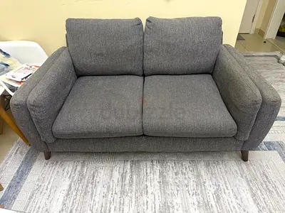 Comfortable 2-Seater Grey Fabric Sofa - Good Condition