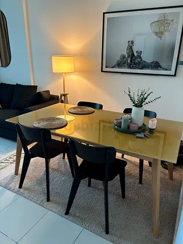 Modern mustard glass-top dining table with chairs