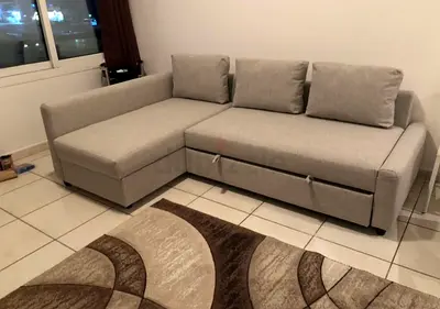 ikea Light grey L-shaped sofa bed with storage — good condition