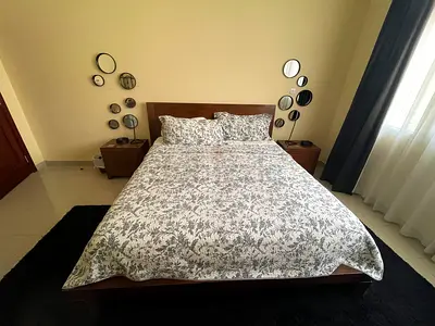 King wooden bed frame with mattress and bedside tables - good condition