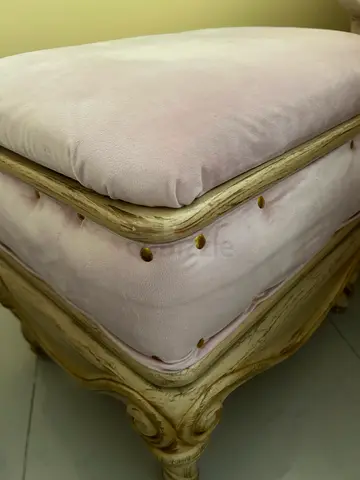 Vintage carved wooden stool/footrest with pink velvet upholstery