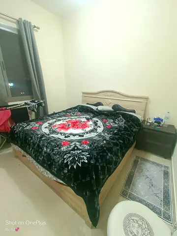 Queen size wooden bed with mattress — good condition