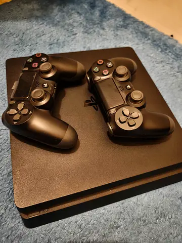 Sony PlayStation 4 Slim with 2 DualShock 4 Controllers - Good Condition