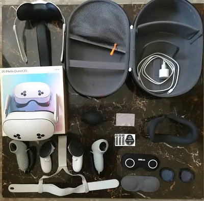 Meta Quest 3 VR headset with accessories (controllers, straps, case, lens protectors)