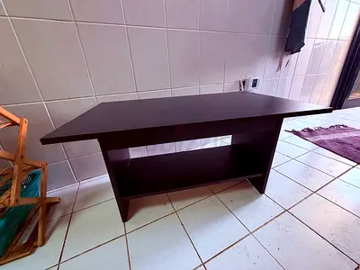 Dark wood coffee table with lower shelf - good condition