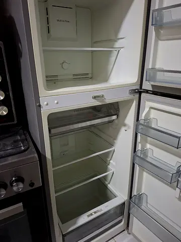 Used double-door refrigerator with freezer - good working condition