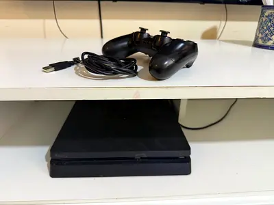 Used Sony PlayStation 4 Slim with Controller (Good Working Condition)