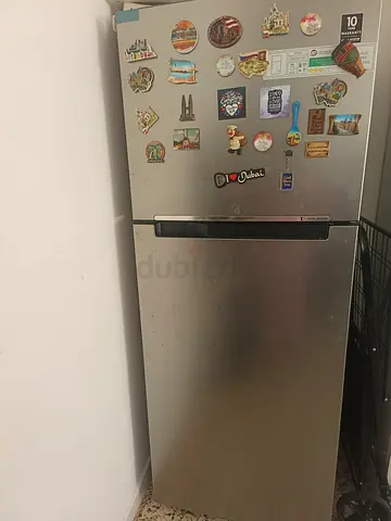 Silver top-freezer refrigerator, good working condition