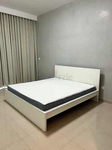 White wooden double bed frame with mattress included