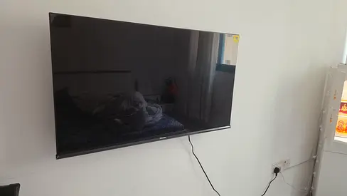 Hisense 43 LED TV mounted on wall - good working condition