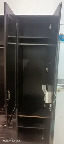 Dark wooden wardrobe with mirror and multiple shelves - good condition