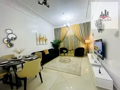 Sharjah, Al Khan area: Apartment available—one bedroom, living room, kitchen, two bathrooms, and a