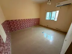 A comfortable apartment in a prime location in Al Hamidiya, featuring a separate living room, bright