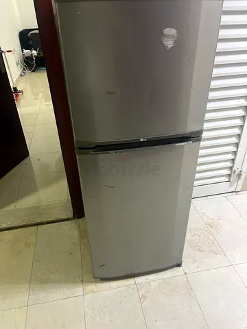 Used Silver Double-Door Refrigerator - Good Working Condition