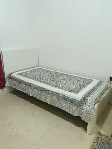 Single white wooden bed frame with mattress included