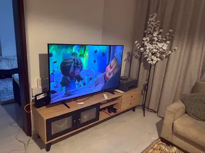 90-inch LED TV in good working condition, includes stand