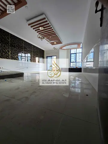 Three-bedroom apartment with a living room for sale in Al Khor Towers, Al Rashidiya, freehold ownership.