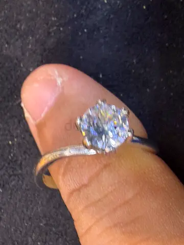 Silver solitaire ring with clear round stone, size approx 6
