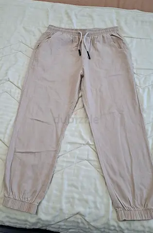 Beige trousers, comfortable fabric, size M