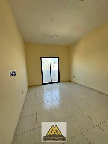 1 bedroom hall in Al Nuaimiya 2, spacious, balcony with good view, central AC, AED 26k, 4 payments, prime location.