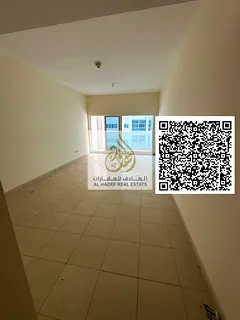 Two-bedroom apartment with a living room in Ajman One Towers. Features include two master bedrooms,
