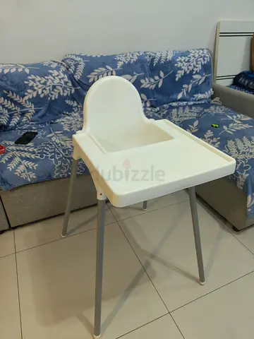 Compact white baby high chair - lightweight and easy to clean