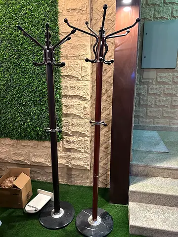 Two freestanding wooden coat racks / hat stands - good used condition