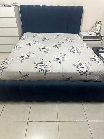 Used upholstered platform bed frame (blue) - low profile, good condition