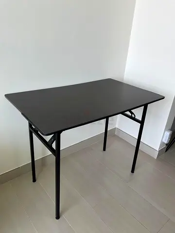 Compact black folding table — light use, good condition