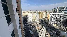 Two-bedroom apartment with a living room in Ajman One Towers. Features include two master bedrooms,