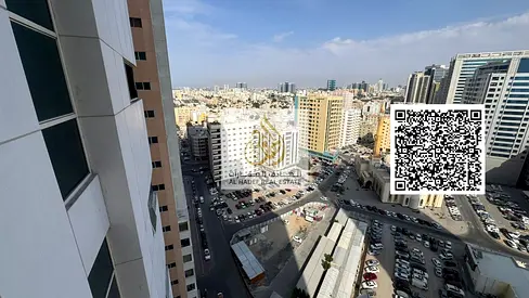 Two-bedroom apartment with a living room in Ajman One Towers. Features include two master bedrooms, three bathrooms, a closed kitchen, a laundry room,