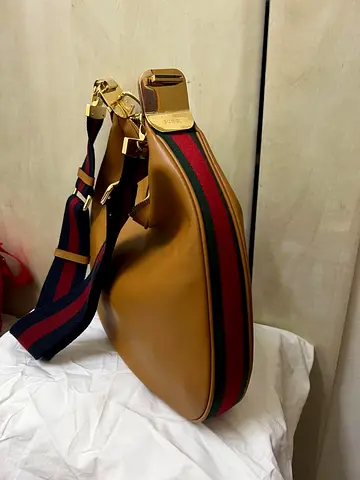 Brown leather shoulder bag with red-green webbing strap  LV slippers