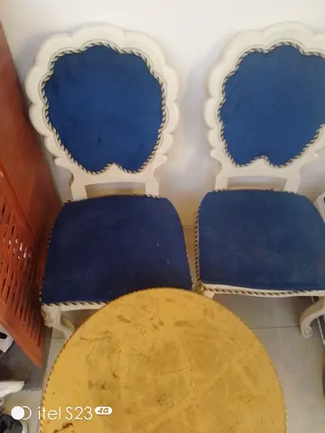 Pair of vintage white wooden dining chairs with blue upholstery