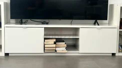 Gloss White TV cabinet with sliding drawers and open shelves.
