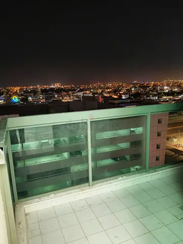 Bed space in room with balcony Aspin Tower