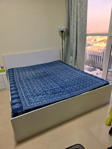 White queen size bed with medical mattress - Excellent condition and white side table.