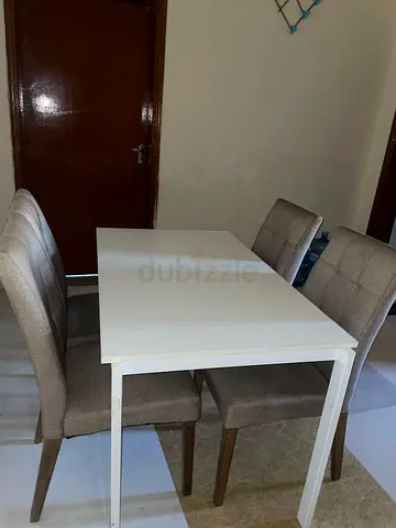 White Extendable Dining Table with 4 Upholstered Chairs - Good Condition