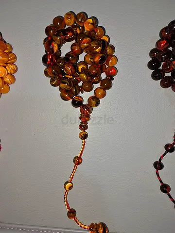 Amber-colored prayer beads (Tasbih) - polished round beads - مسباح خراطة عمار حسين