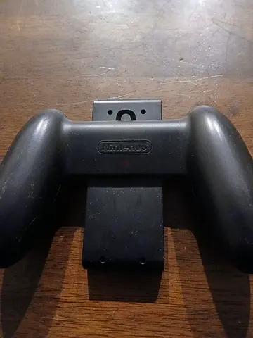 Nintendo Switch Black joycon holder. (Joycons not included)