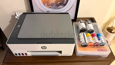 HP Smart Tank Printer with Extra Ink Bottles - Good Condition and papers