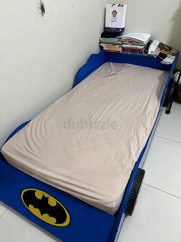 Blue Batman themed single kids bed with mattress included and no bedsheets