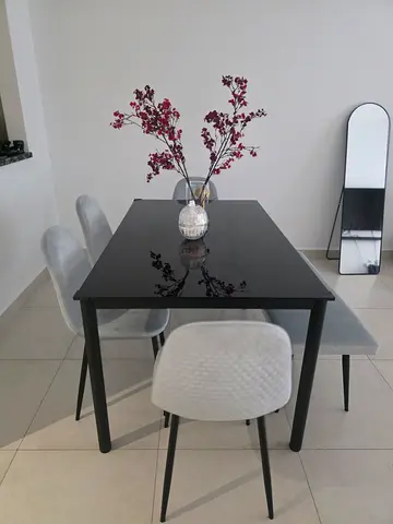Modern black dining table with 4 upholstered chairs - excellent condition