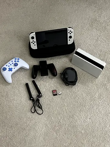 Nintendo switch oled in perfect condition with a lot of stuff 1500 more details in description