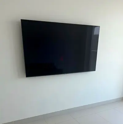 55-65 inch LED TV - Good condition, wall-mounted